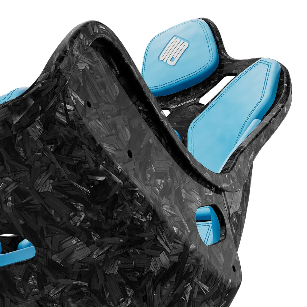 Close-up of the blue cushions and side opening on the SIMGASM Atlas Formula seat with a Forged Carbon Look shell