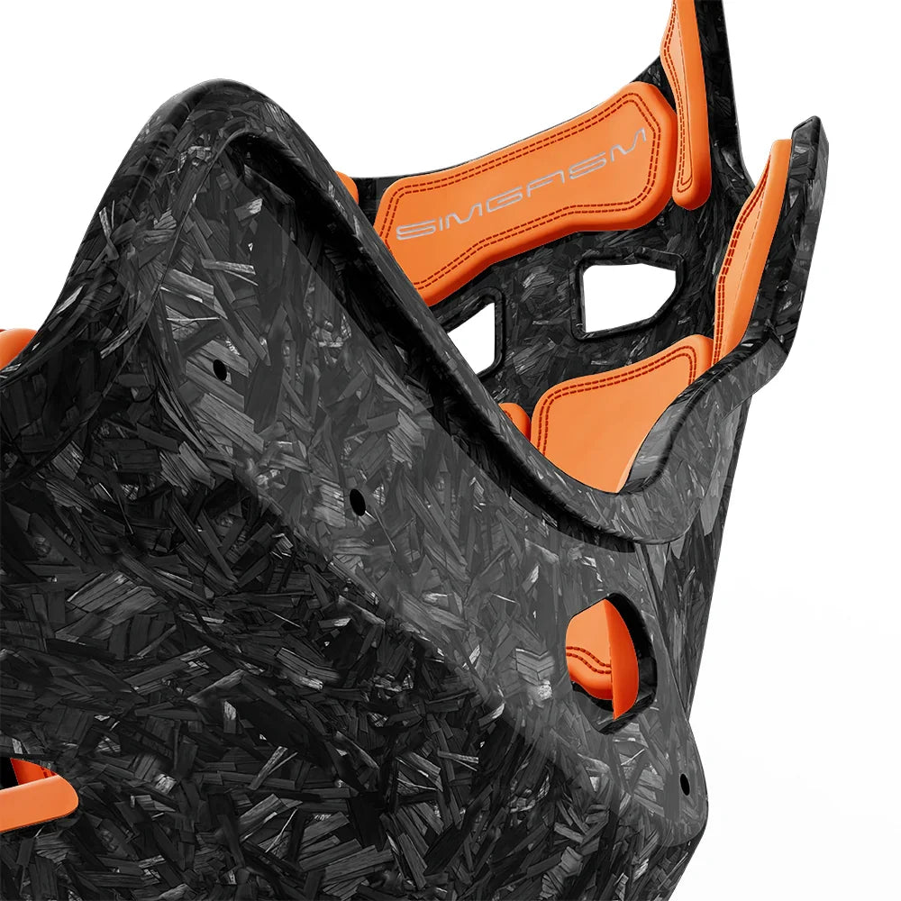 Close-up of the orange cushions and side shell on the SIMGASM Atlas GT seat with a Forged Carbon Look shell