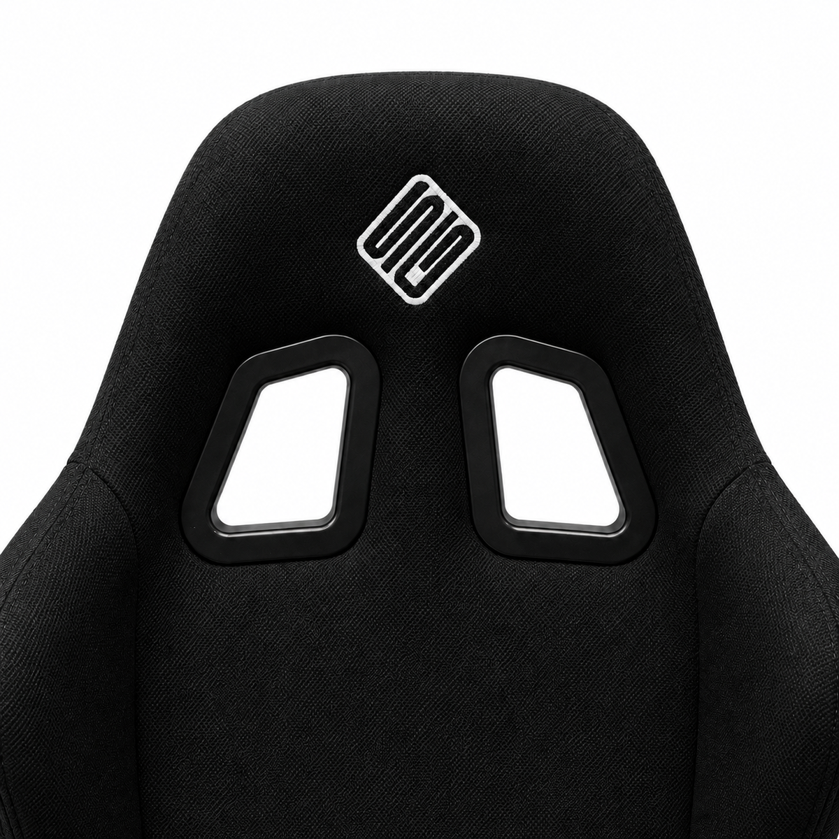 Close-up of the SIMGASM Core bucket seat headrest and twin harness openings