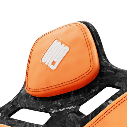 Close-up of the orange headrest cushion on the SIMGASM Atlas Formula seat with a Forged Carbon Look shell