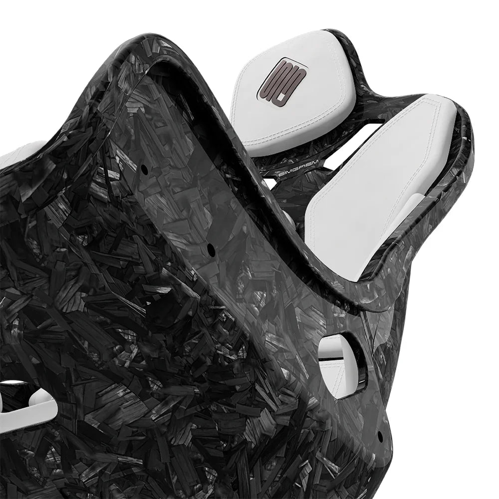 Close-up of the white cushions and side opening on the SIMGASM Atlas Formula seat with a Forged Carbon Look shell