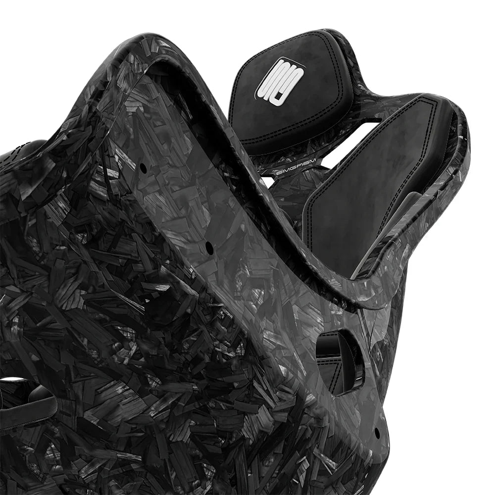 Close-up of the black cushions and side opening on the SIMGASM Atlas Formula seat with a Forged Carbon Look shell