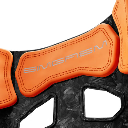 Close-up of the orange upper backrest cushion on the SIMGASM Atlas GT seat with a Forged Carbon Look shell